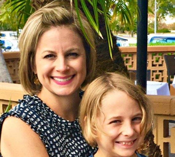 Corbin Laslo, 10, a mentor who helps other children in the UCF anxiety program overcome their shyness, and his mother, Leslie.