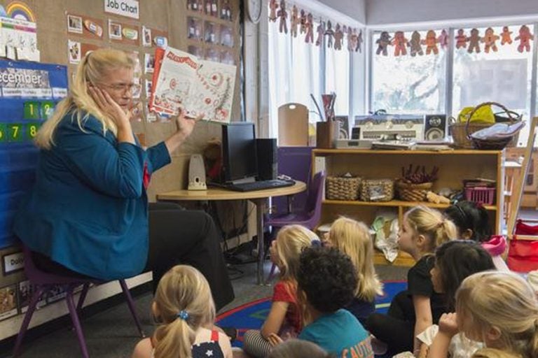 Preschoolers at UCF's Creative School listen to 'How the Grinch Stole Christmas!" Tuesday morning.