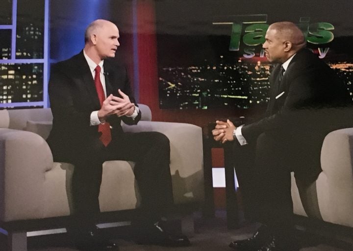 UCF's Thomas Cavanagh explains the university's distributed learning to TV host Tavis Smiley.