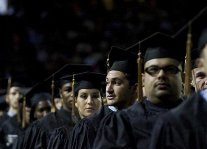 students at graduation, waiting to go on stage