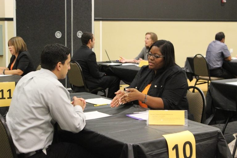 job fair woman interviewing man