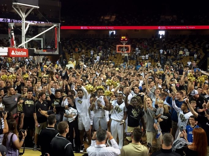 Knight fans charged the court after UCF's victory over No. 15 Cincinnati at CFE Arena Sunday.
