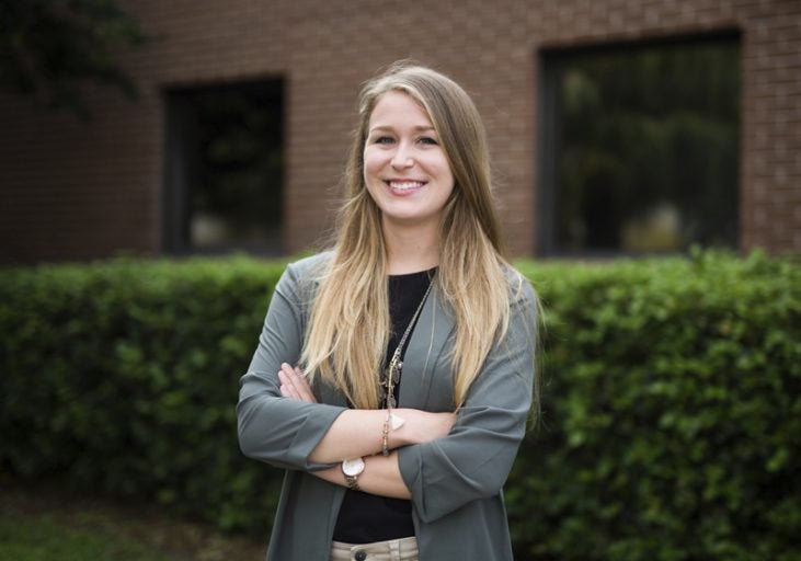Hannah Hollinger stands outside UCF's Facilities and Safety building, where she created a student sustainability committee. Photo: Bernard Wilchusky