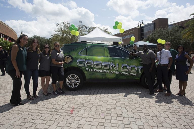 Green Dot Strategy Coordinator Sam Vega (far left) and the Green Dot Implementation Team have helped to spread the message of bystander intervention across campus.