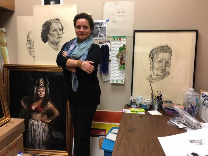 Raimundi-Ortiz in her UCF studio, surrounded by her sketches and portraits of previous "Reinas/Queens."