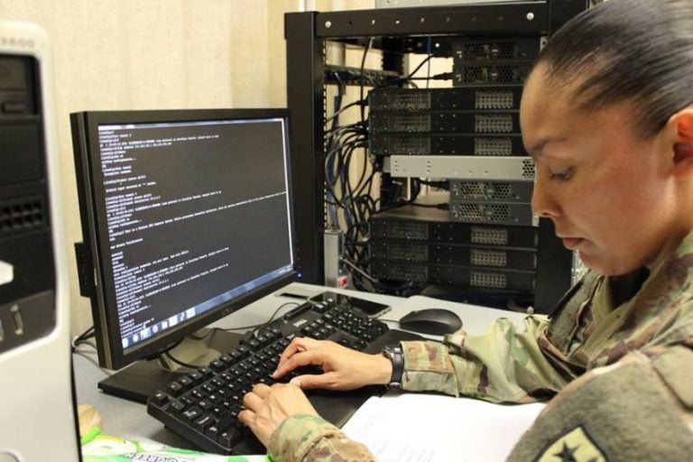 army soldier Cybertraining at laptop
