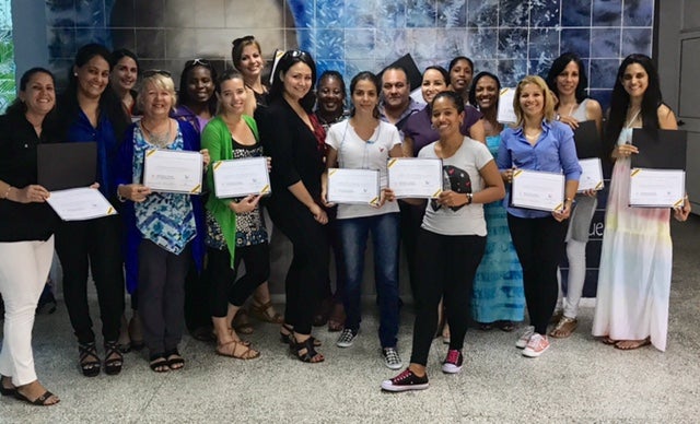UCF Nicholson School of Communication's Katie Coronado and Erica Rodriguez Kight with Universidad de Cienfuegos students and faculty after attending a workshop while visiting Cienfuegos.