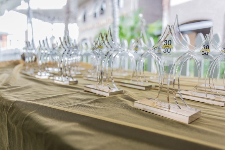 table with gold tablecloth and wine glasses set out