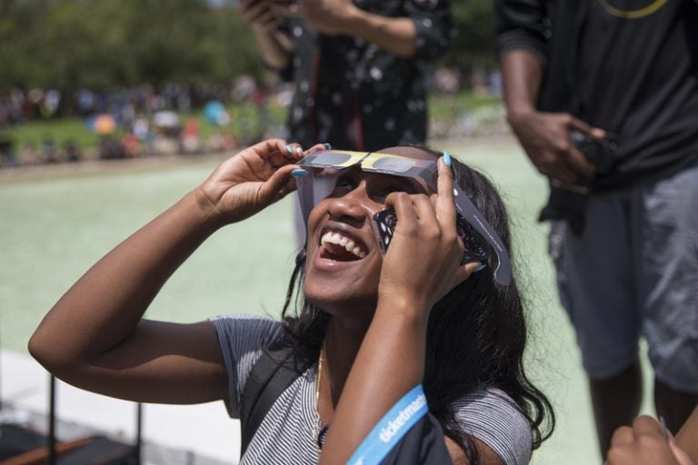 student with solar eclipse glasses at Solar Eclipse Viewing session