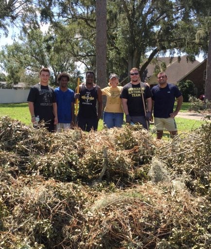 UCF Wrestling Club members spent several days in several neighborhoods cleaning up.