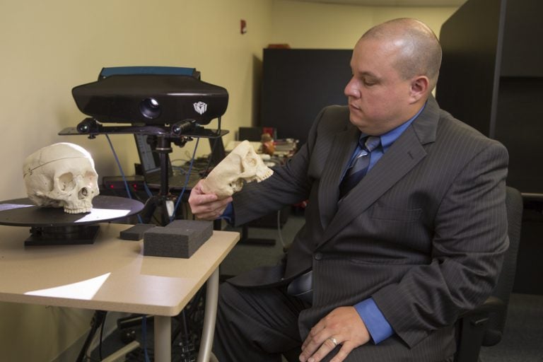 John Starbuck sitting at desk