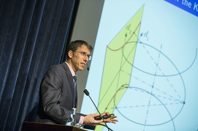 Alexander Katsevich giving lecture in front of projector screen