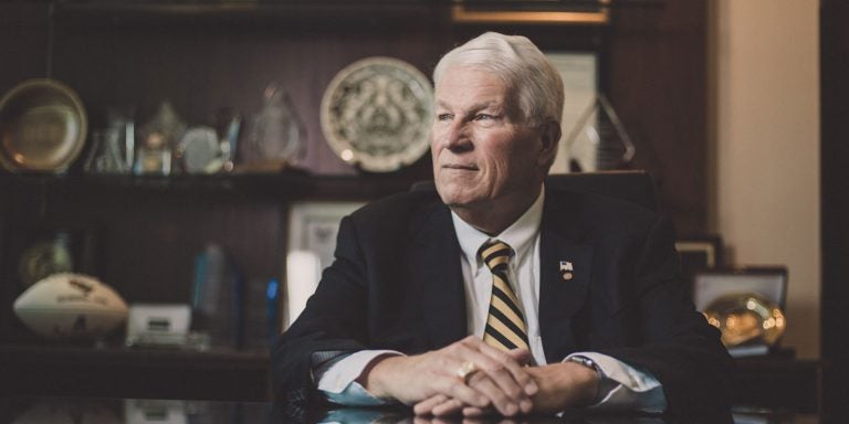 dr hitt sitting in office looking to the left pensively