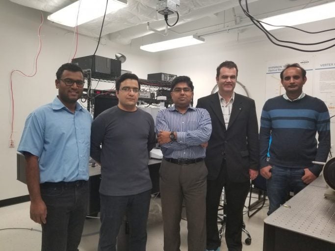 group of men posing in a lab