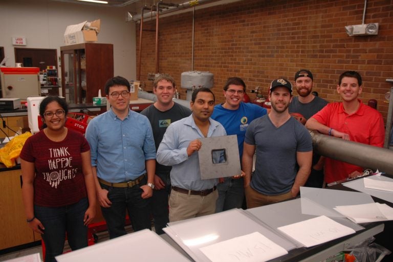 assistant professor of mechanical and aerospace engineering works with his student research team testing next-generation fuels to find out which ones are actually better for cars and the planet