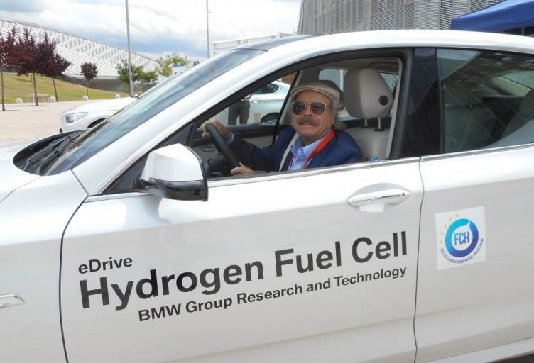 man driving hydrogen fuel car
