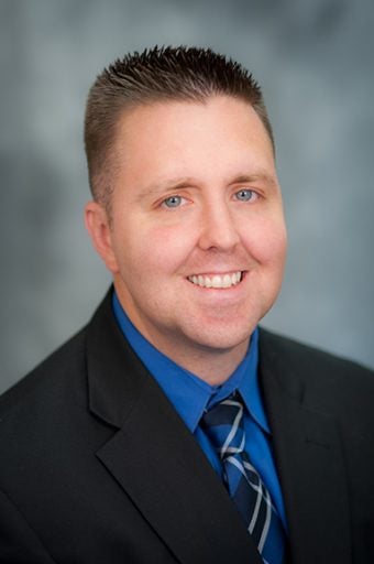 matt stock headshot in front of grey background