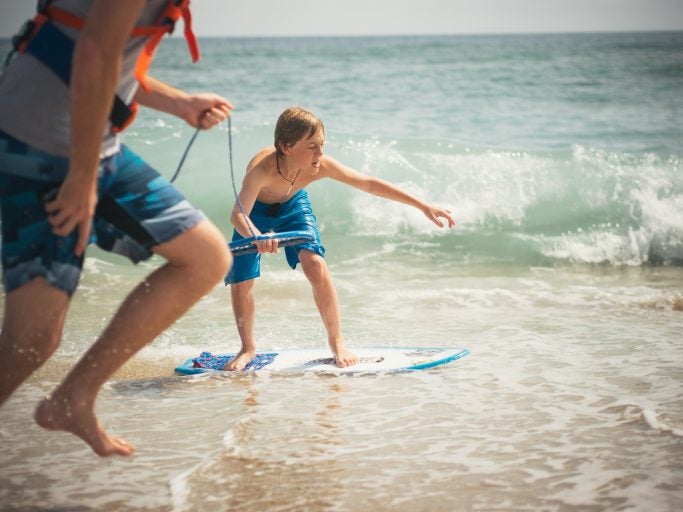 children skimboarding