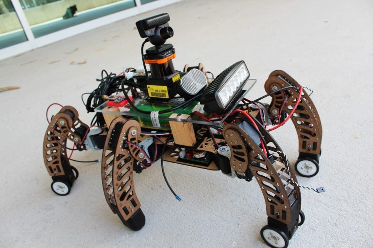 During the Spring 2018 Senior Design Showcase, "SigSent," a six-legged surveillance robot, will display its ability to walk on rough terrain and roll on smooth surfaces.