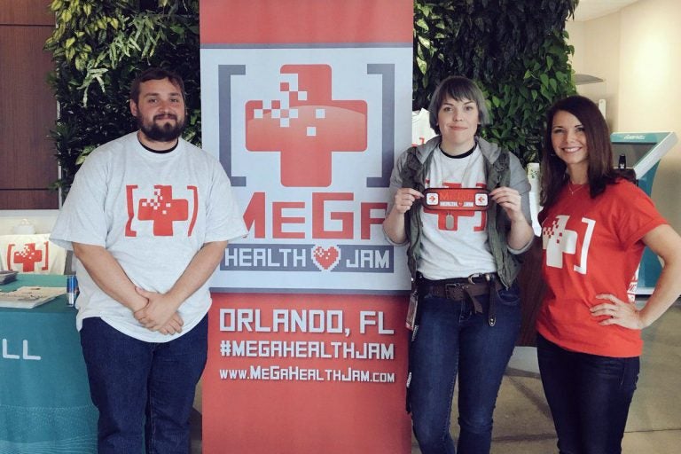 During the inaugural MeGa Health Games, organized by Kelli Murray (right), interactive entertainment master's program students Christine Wright and James Gaiser won first place for their app that aims to improve doctors' visits. (Photo courtesy of MeGa Health Jam)