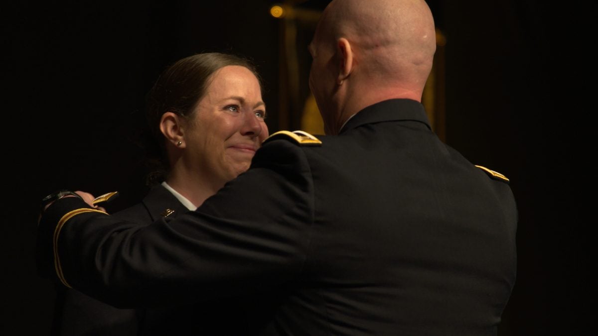 Melissa Smith is pinned by her husband, Arron Smith, a fellow UCF medical student and Army veteran, during the College of Medicine’s commencement.