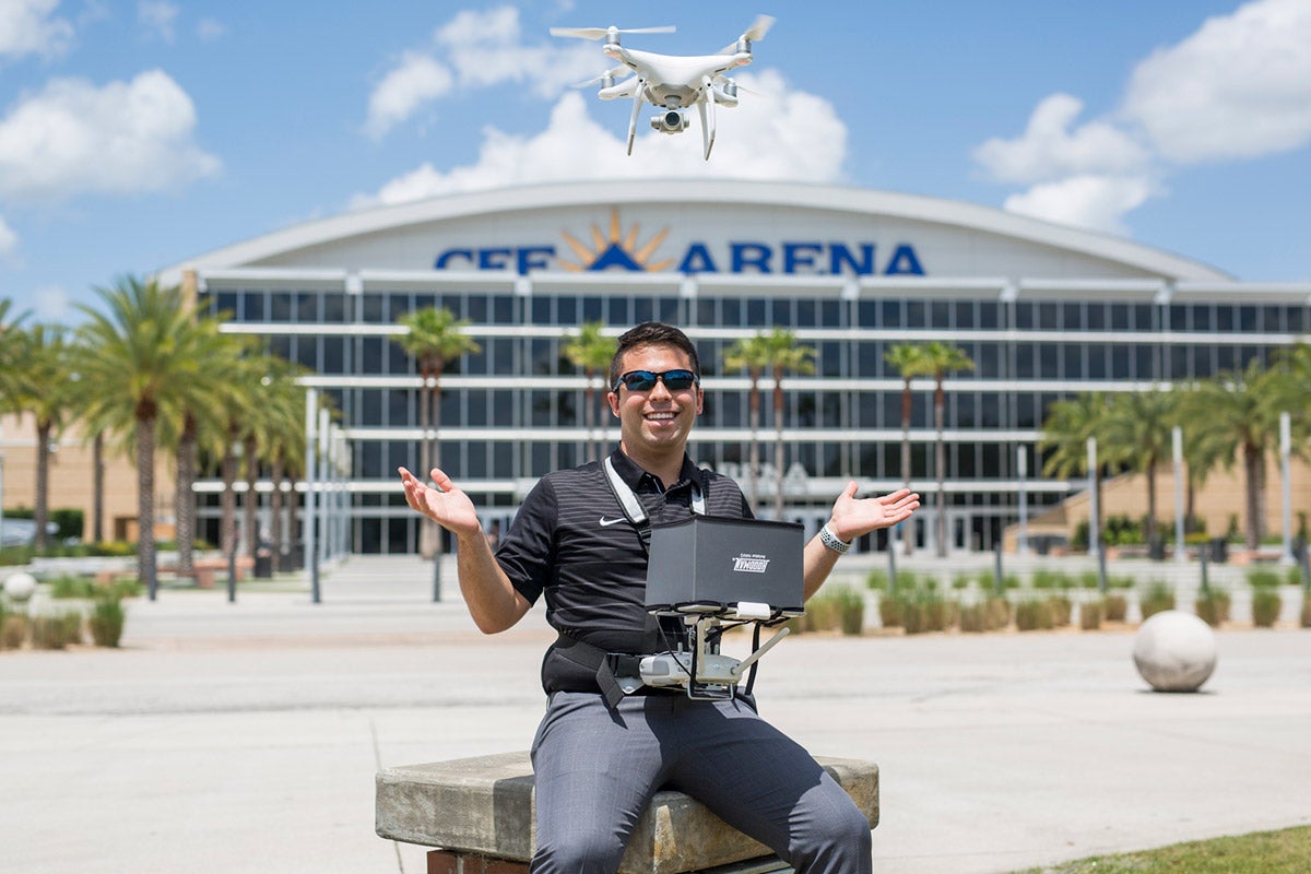 As an intern for UCF's Department of Security and Emergency Management, sophomore Michael Feinman uses his drone to help advance security on and off campus. (Photo by Bernard Wilchusky ’18)