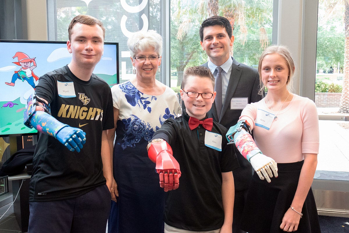 Anne Smallwood (second from left) is providing UCF-based Limbitless Solutions a big gift.
