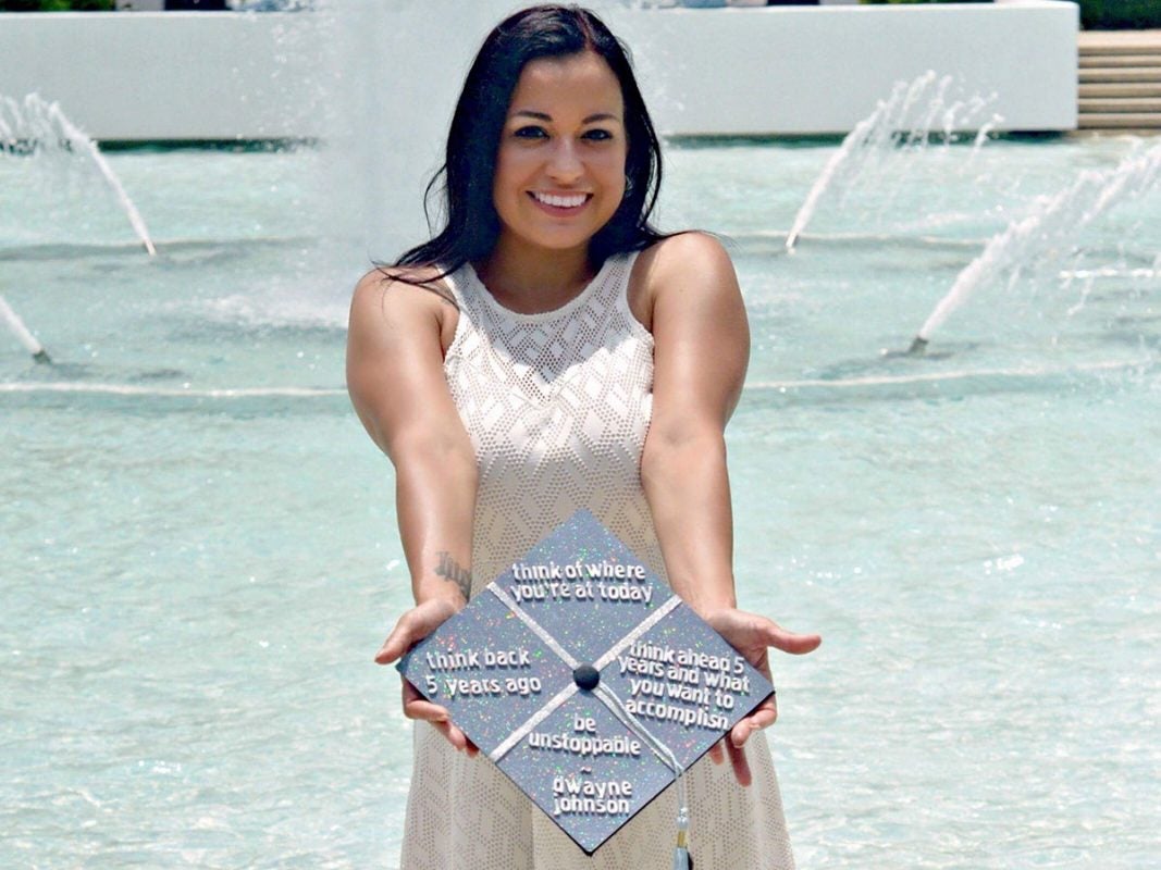 Photo of Heather Robison and grad cap