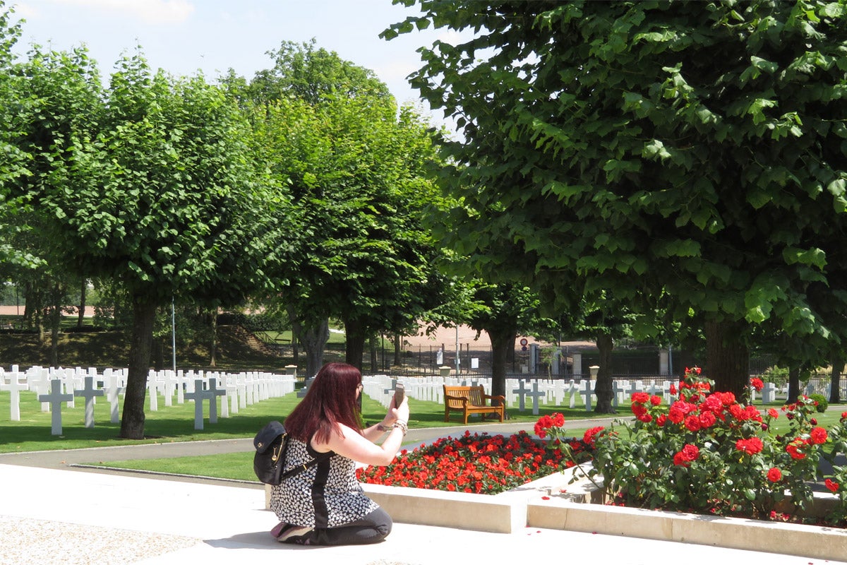 Graduate history student Kayla Campana ’15 takes photos at the Suresnes American Cemetery near Paris, France, as part of the UCF Veterans Legacy Program team.