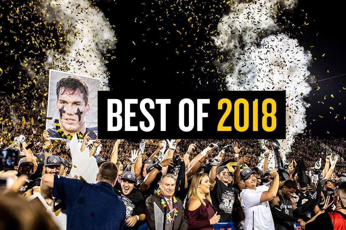 UCF football team holds AAC trophy with confetti and smoke shooting into night sky