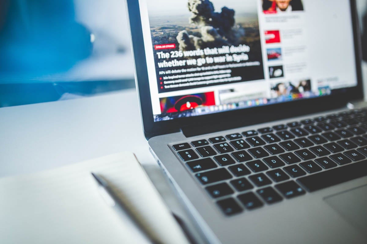 keyboard with news story showing on screen