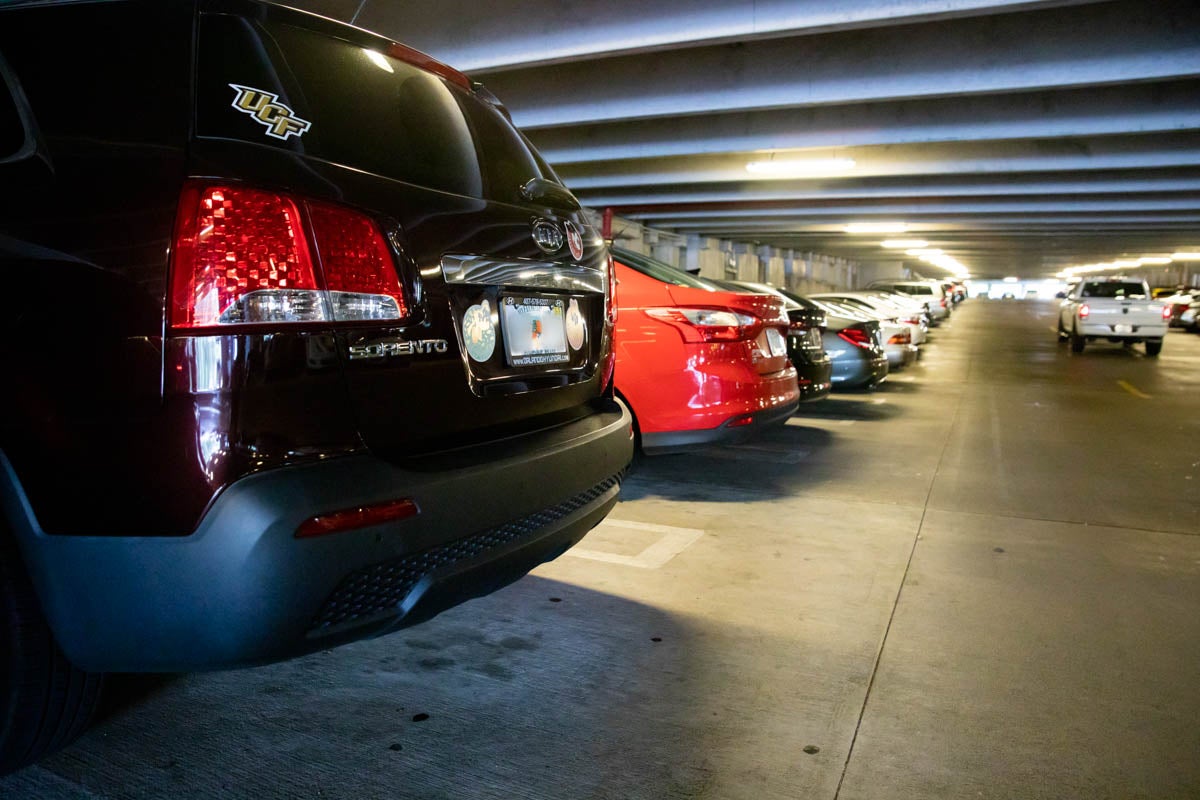 Cars parked in a garage for story about virtual parking permits.