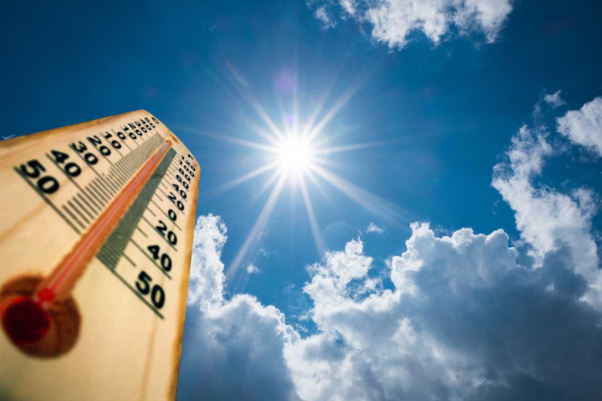 thermometer points toward sunshine and blue skies