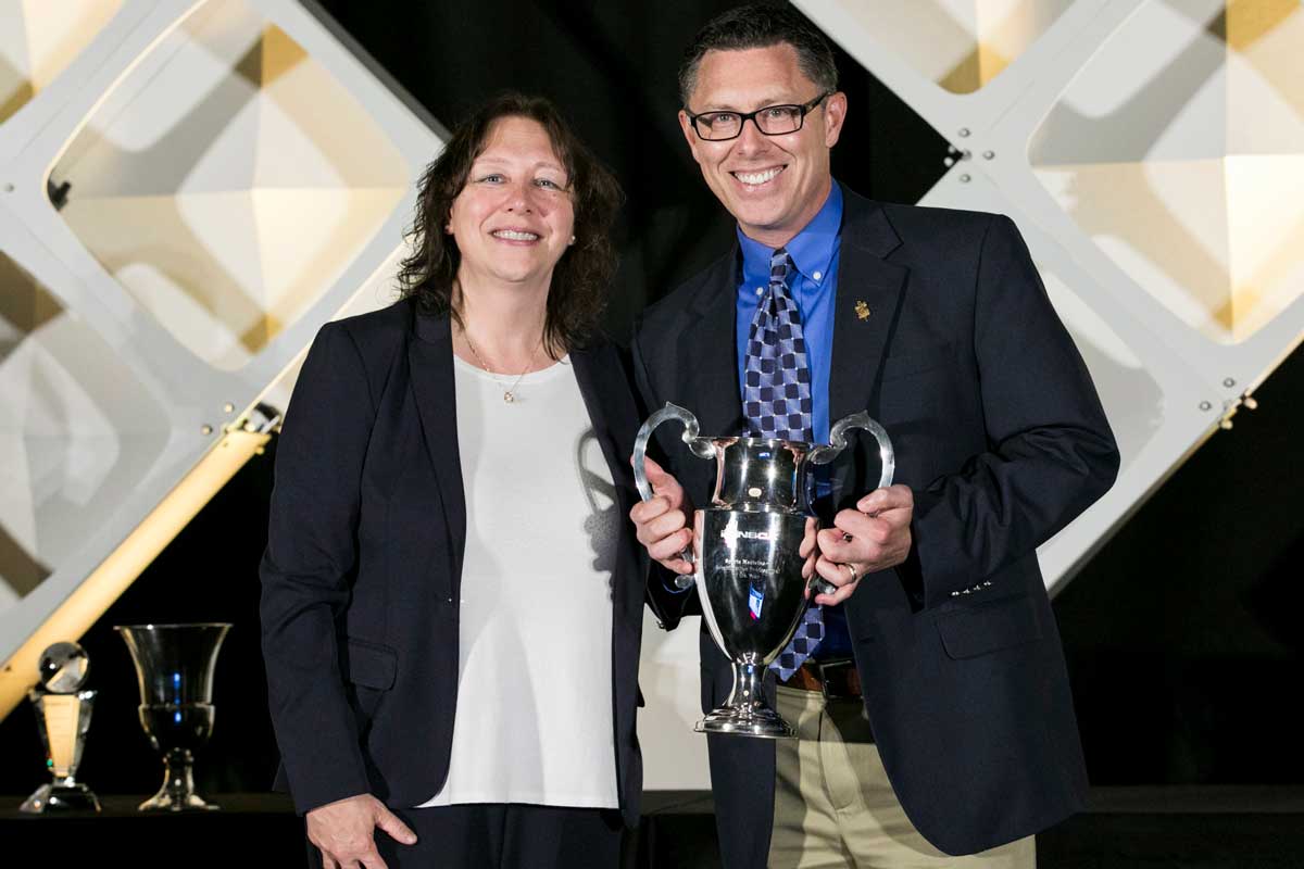 At left, N. Travis Triplett, president of the National Strength and Conditioning Association, presents the Sports Medicine/Rehabilitation Specialist Award to William Hanney.