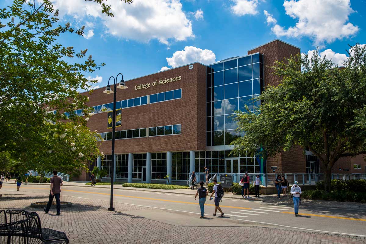 College of Sciences academic building with people outside