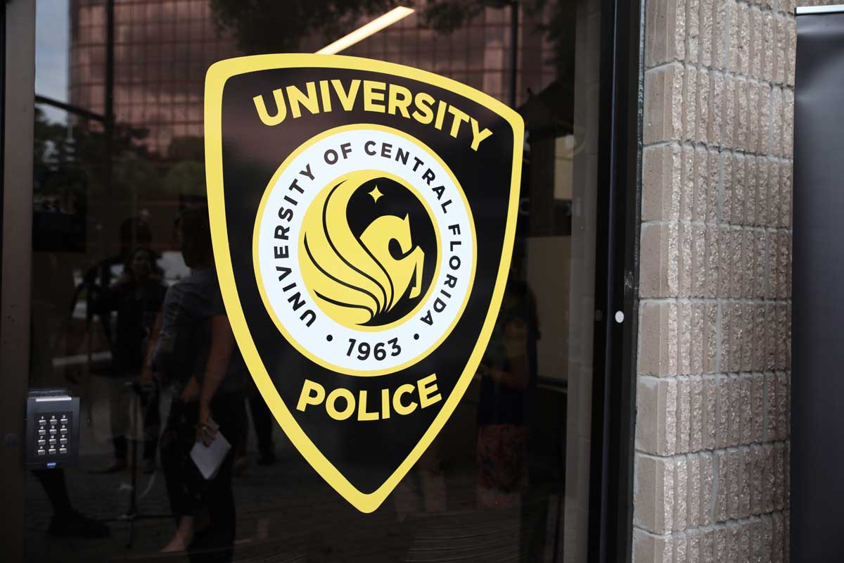 University of Central Florida police logo on glass window of office building