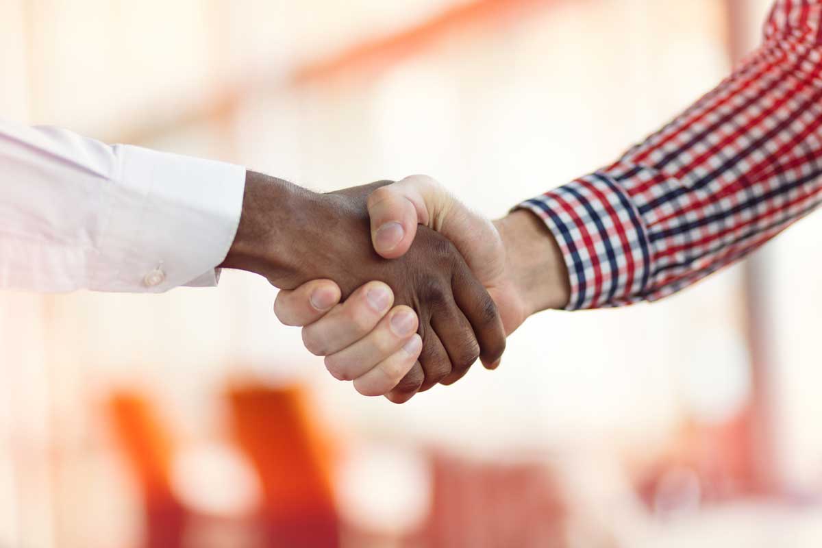 handshake between black and white males