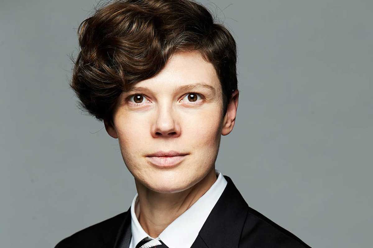 Headshot of brunette woman wearing business suit