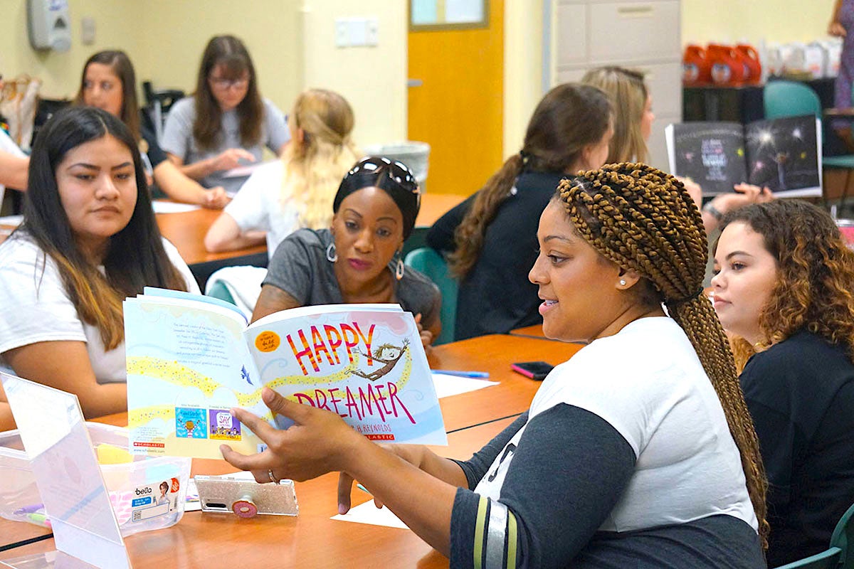 UCF elementary education students work with high school students from Tavares Teaching Academy