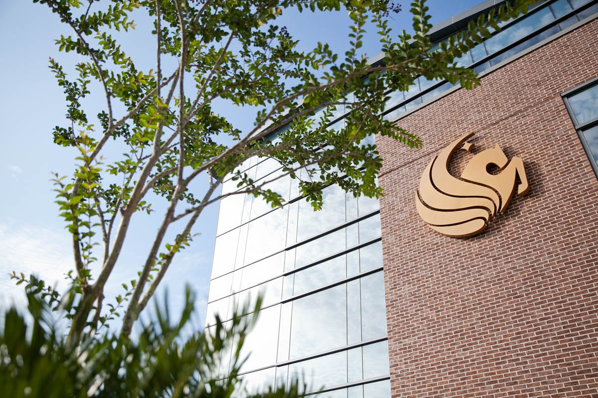 The Pegasus symbol on the outside of a campus building.