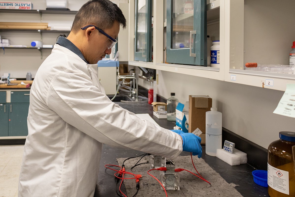 Yang Yang works in his lab.