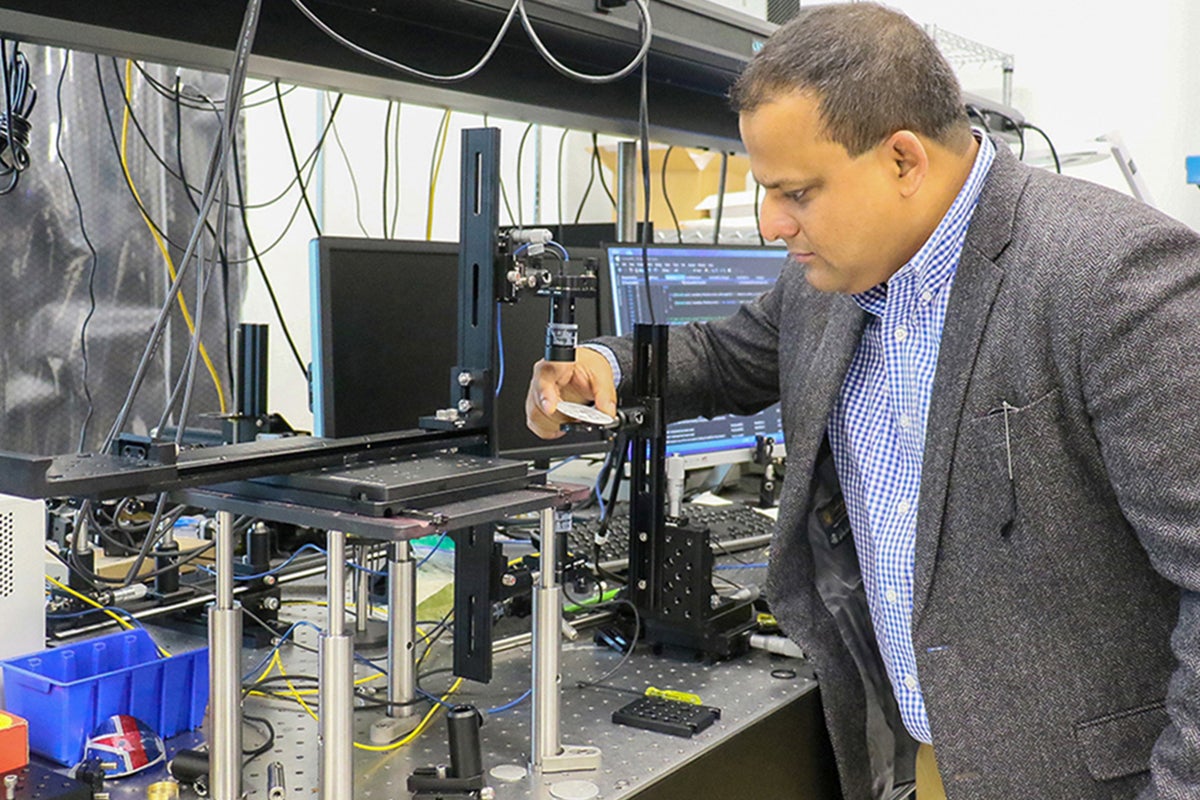 Kausik Mukhopadhyay, senior lecturer and researcher at UCF’s Department of Materials Science and Engineering, works in his lab.