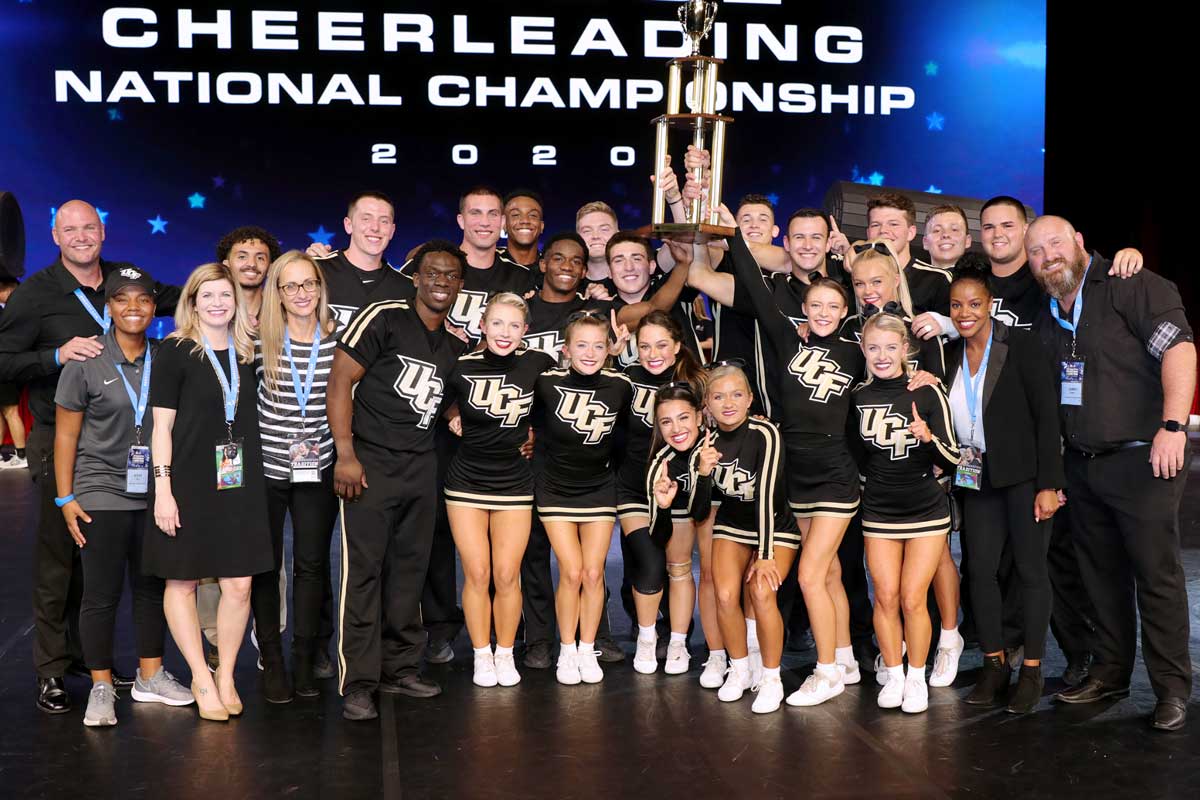 UCF cheer team poses with national championship trophy