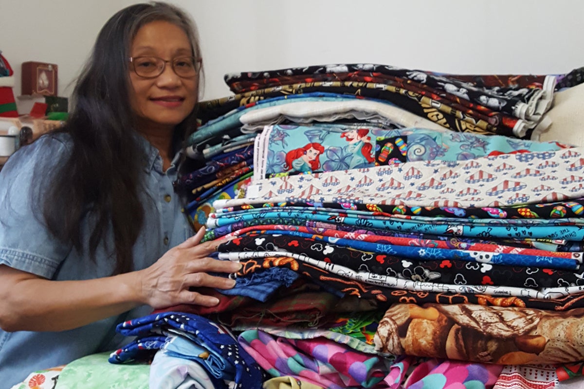 Chris Dantes poses with her fabric.