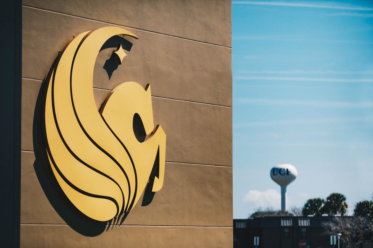 A Pegasus symbol on a building with the Water Tower in the background.