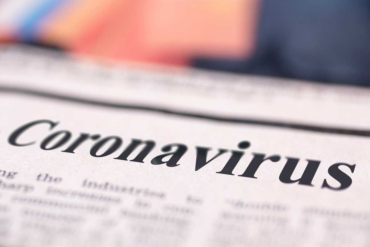 Closeup of coronavirus headline in newspaper