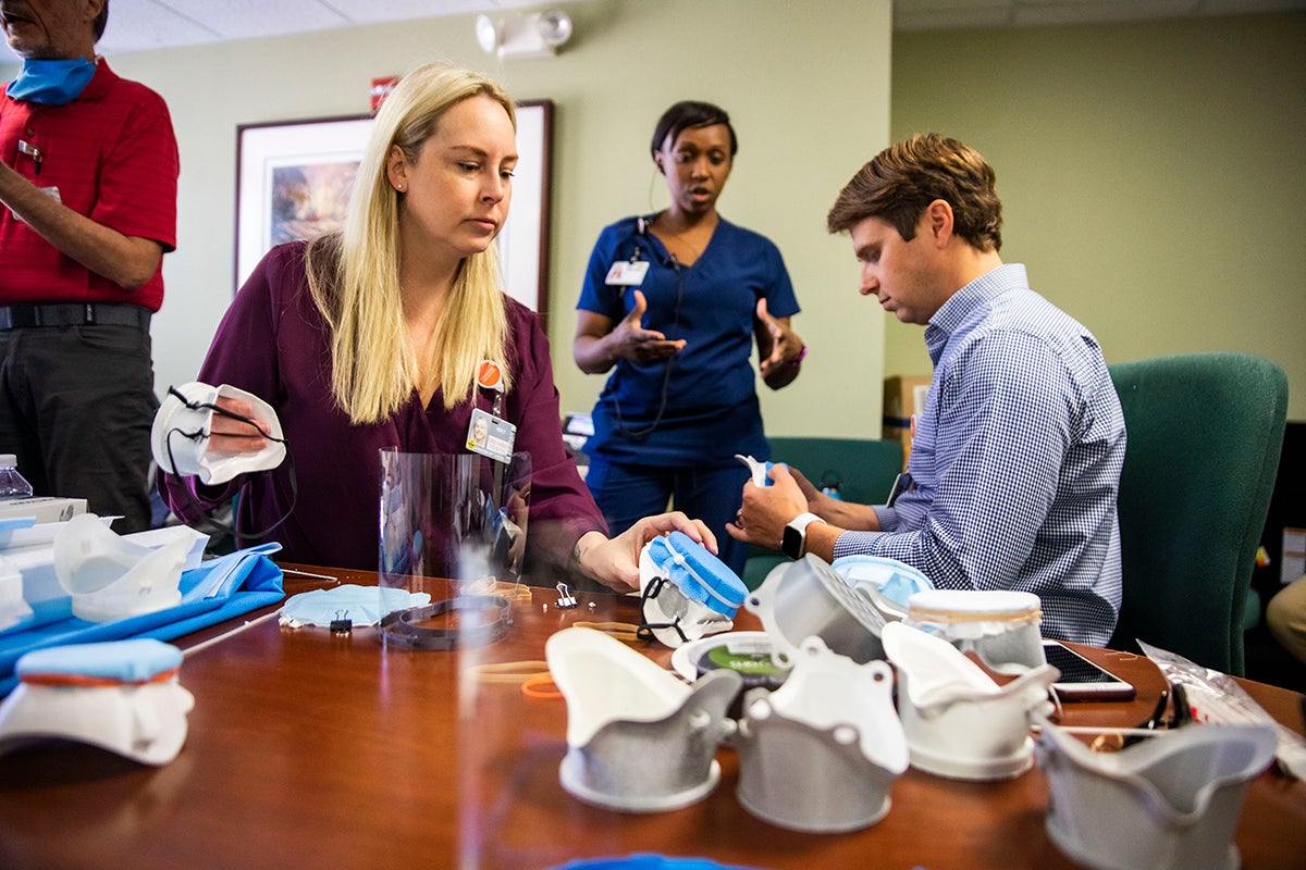 People examine 3D printed medical supplies