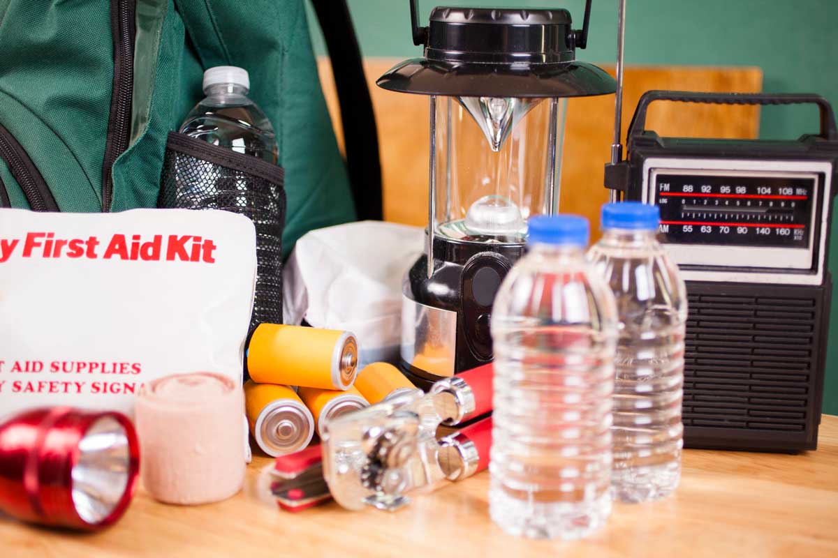 first aid kit, water bottles, radio, and other hurricane supplies