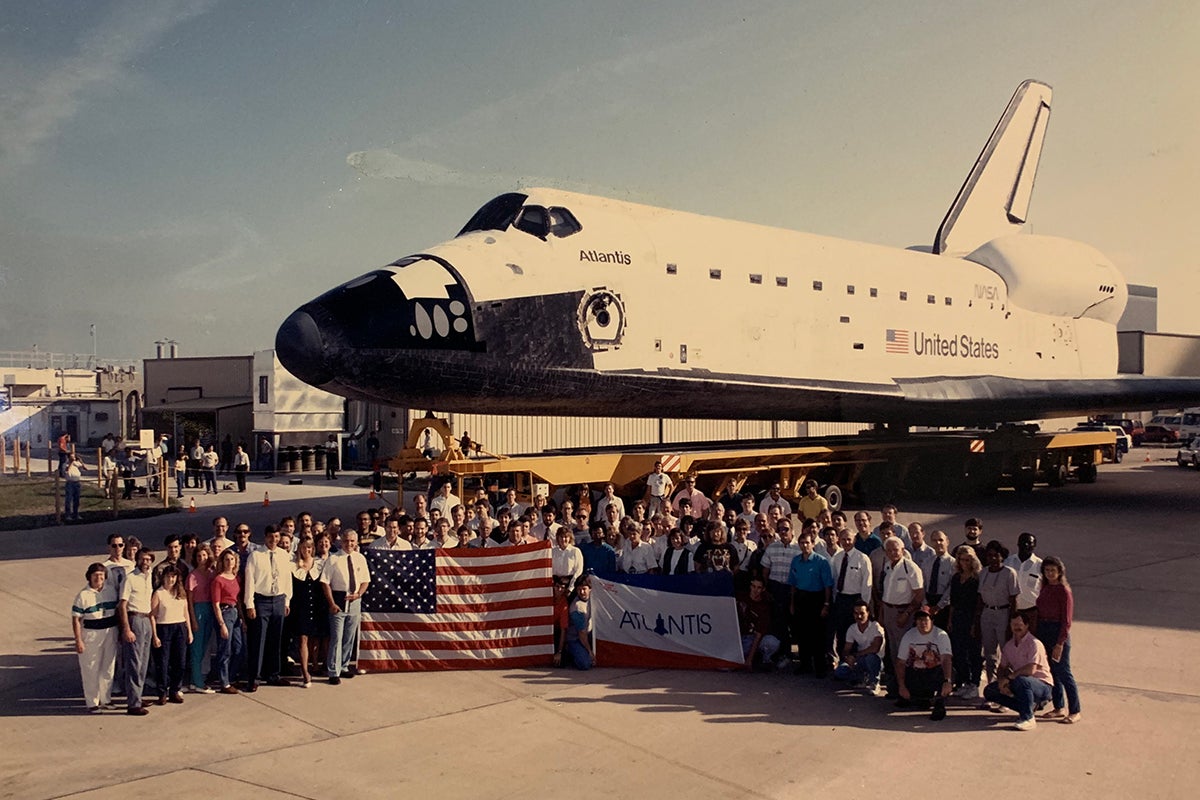 space shuttle Atlantis with NASA workers
