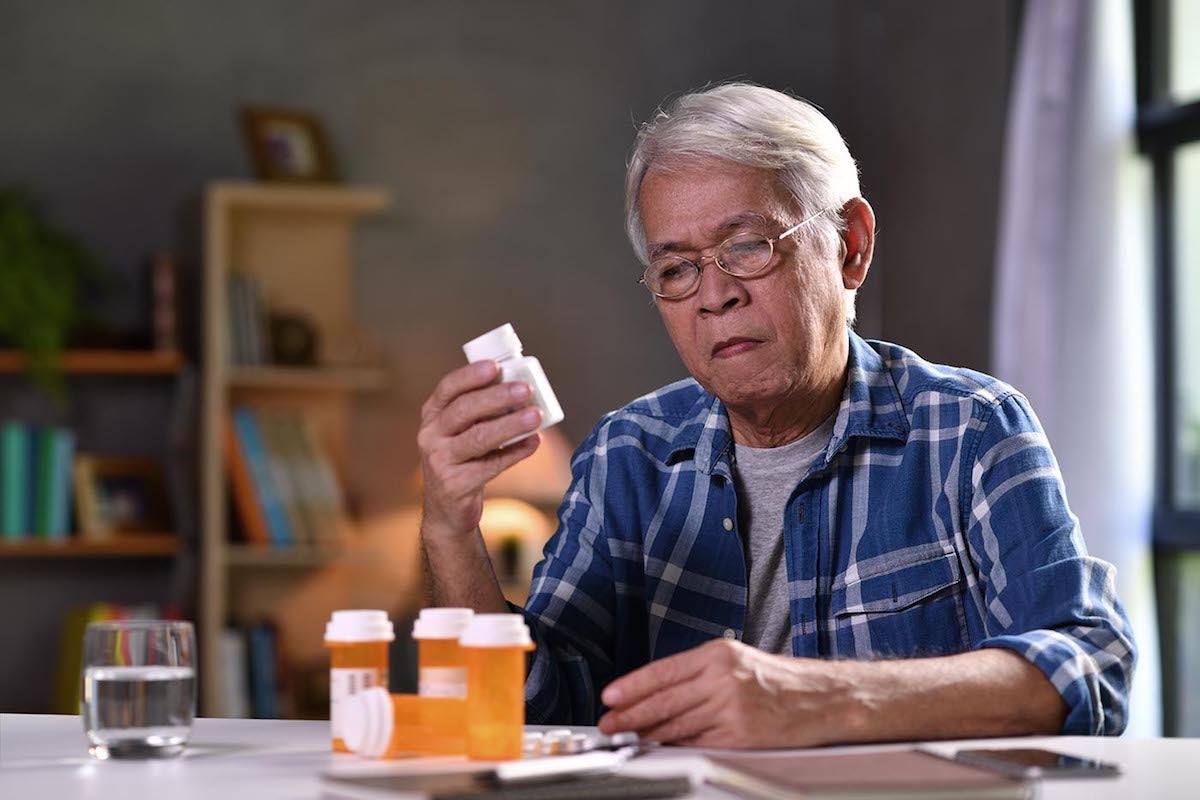 Senior man with his medicine bottles